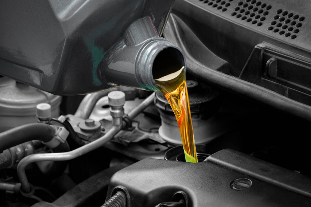 Pouring oil into the engine motor